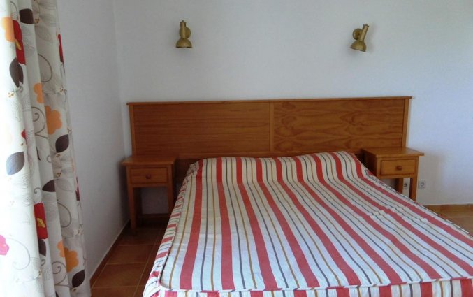 Tweepersoonsbed in een kamer van Appartementen Mirachoro 2