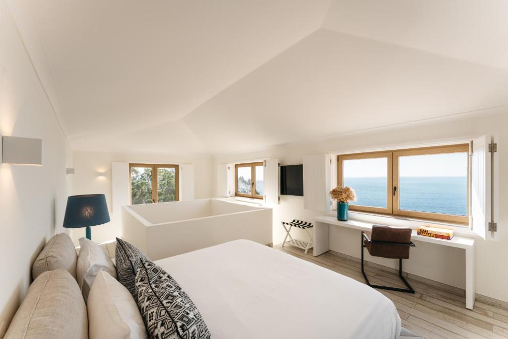 Casa Pôr do Sal - suite met zithoek en zeezicht
